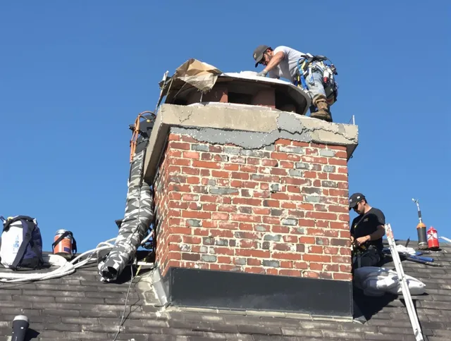 South Windsor Chimney Sweep installing a custom chimney crown in South Windsor, CT
