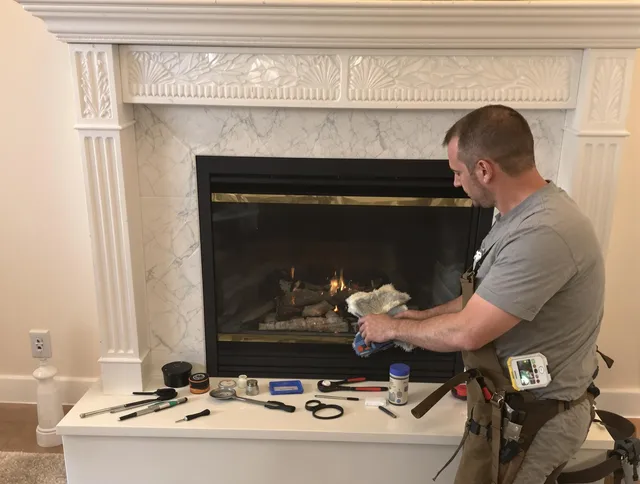 South Windsor Chimney Sweep performing fireplace maintenance in South Windsor, CT