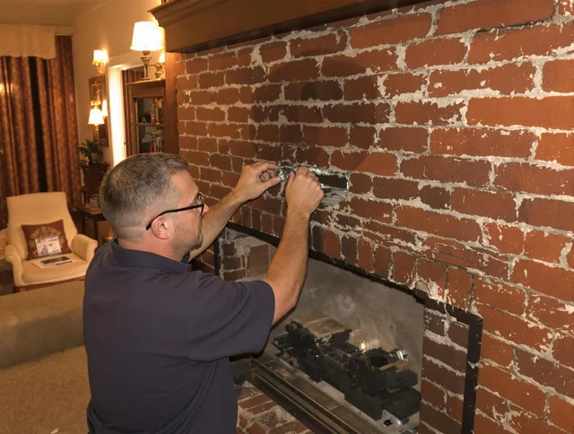 South Windsor Chimney Sweep expert fixing a fireplace in South Windsor, CT